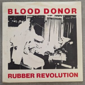 Blood Donor – Rubber Revolution.:7" - 1979 UK Press, Red Vinyl (יד שנייה)